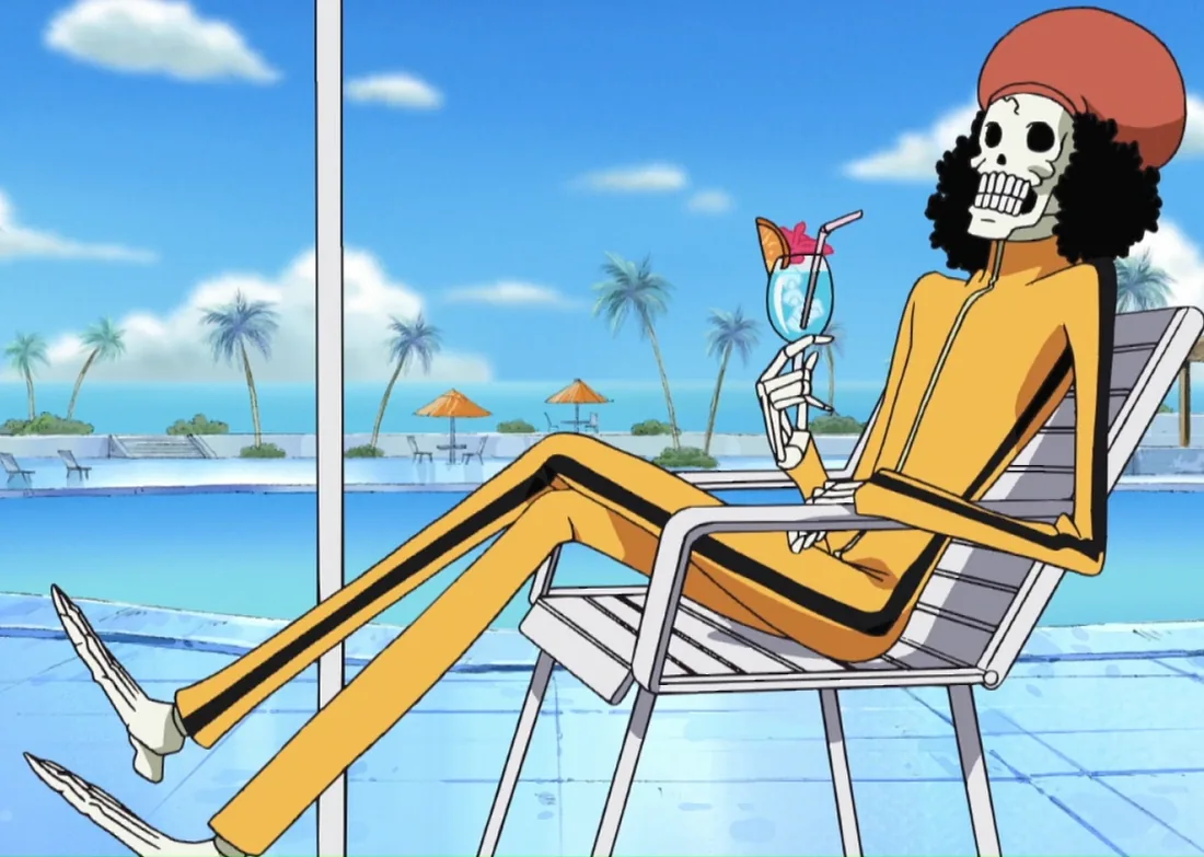 Brook relaxing in a deck chair with a drink