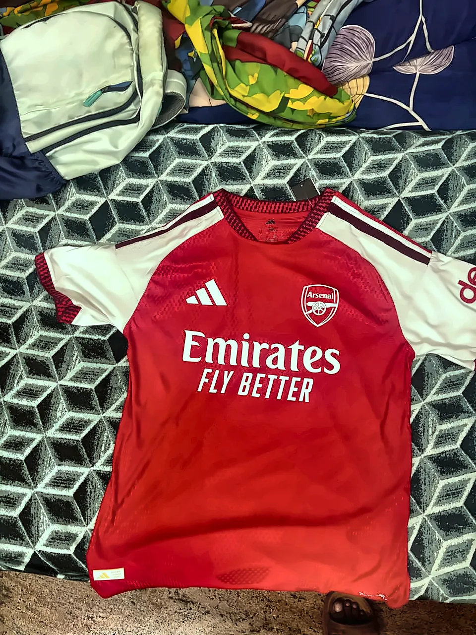 an Arsenal home shirt