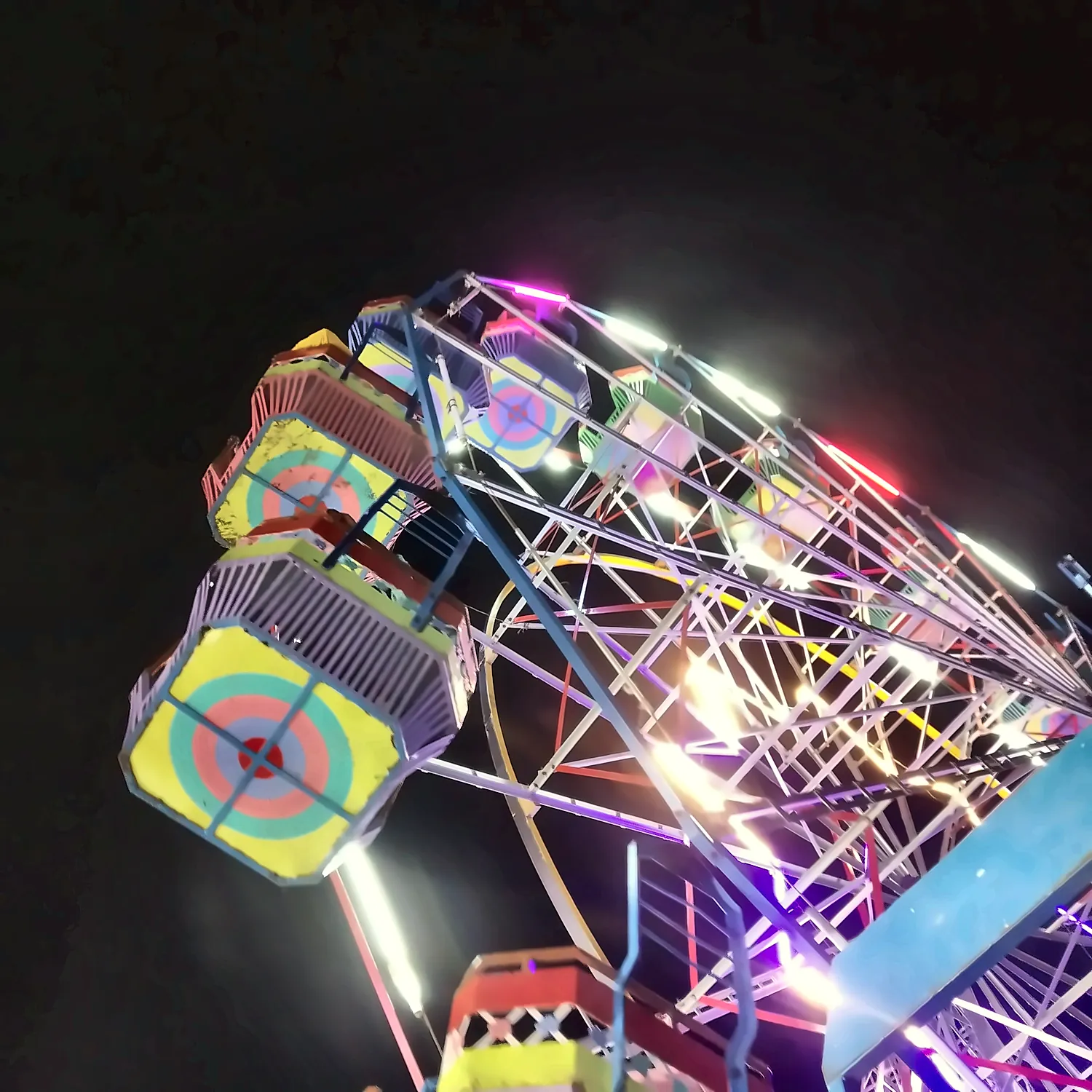 a ferris wheel lit up at night