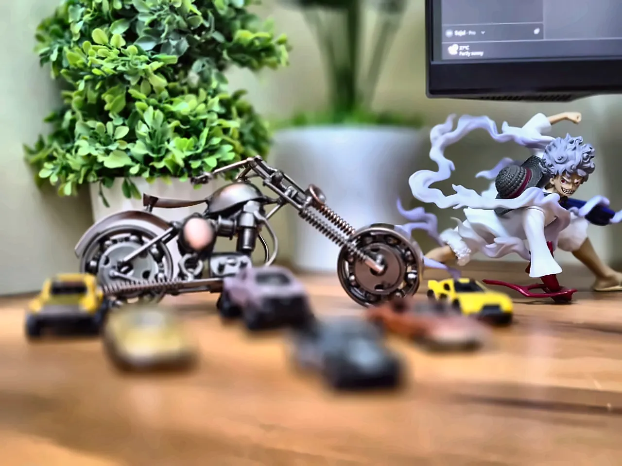 a Gear 5 Luffy figure beside a model motorbike