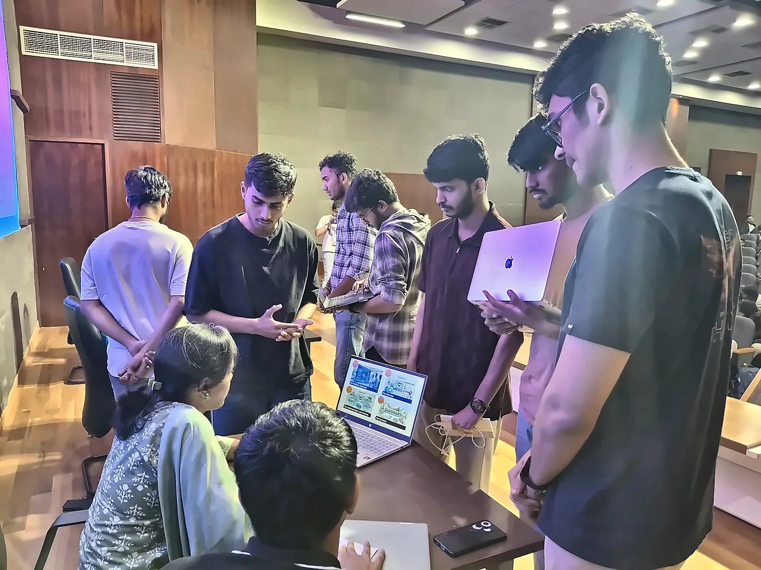 a group of us around laptops at an event