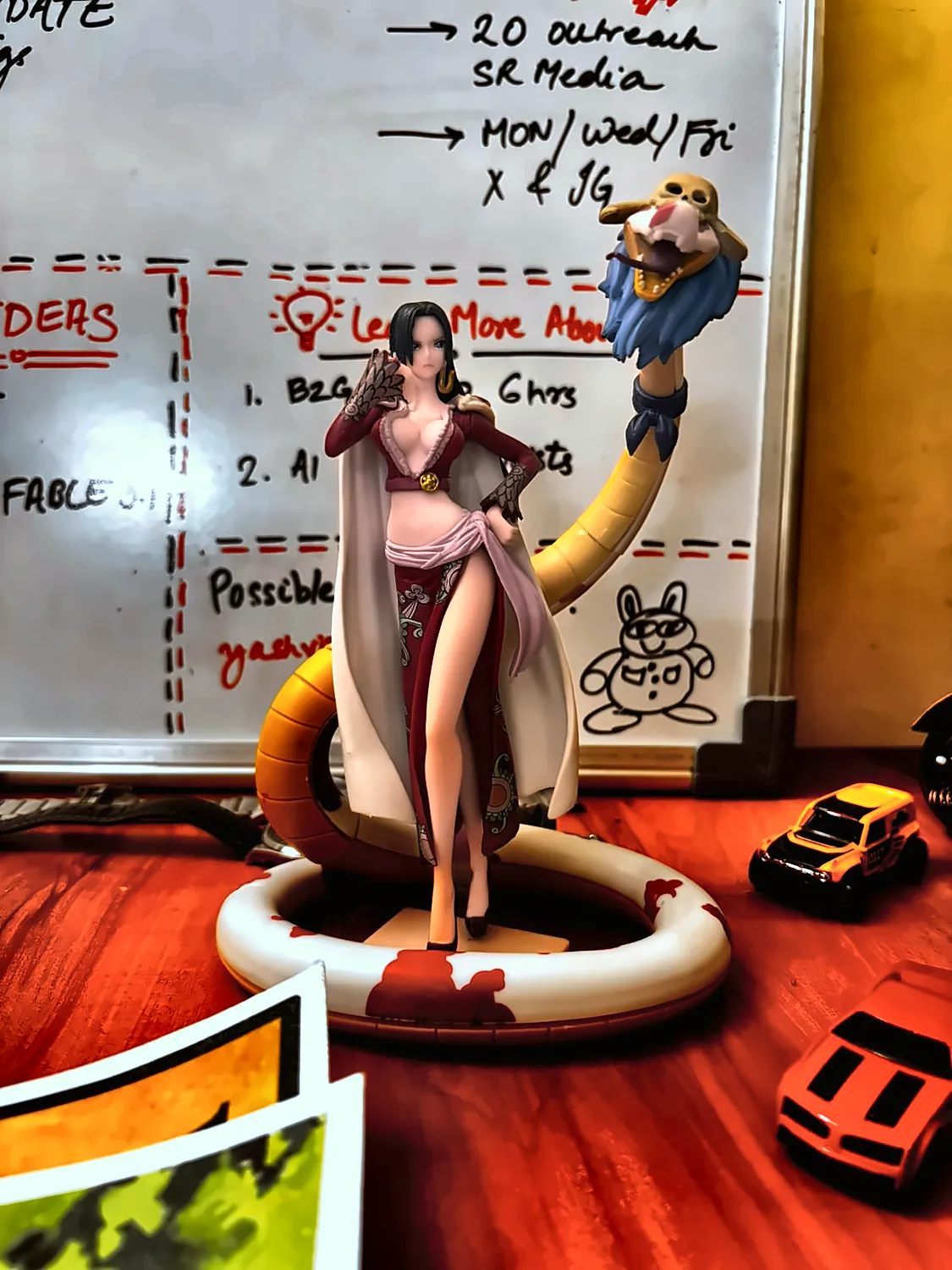a Boa Hancock figure on the desk