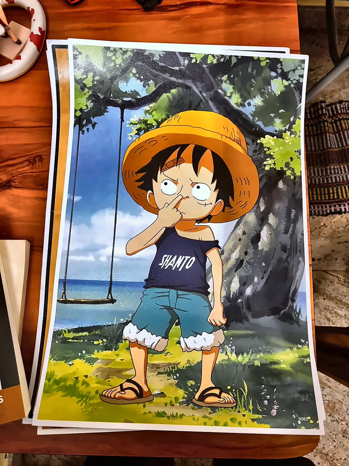 a poster of young Luffy in his straw hat