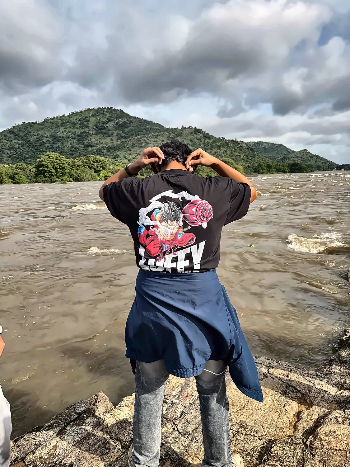 me by a river, in a Luffy t-shirt